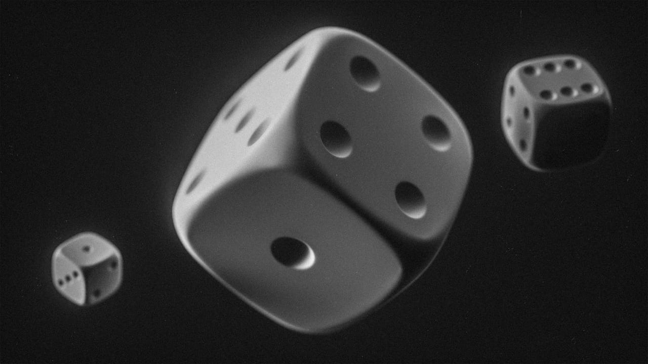 Three dice falling against a dark background